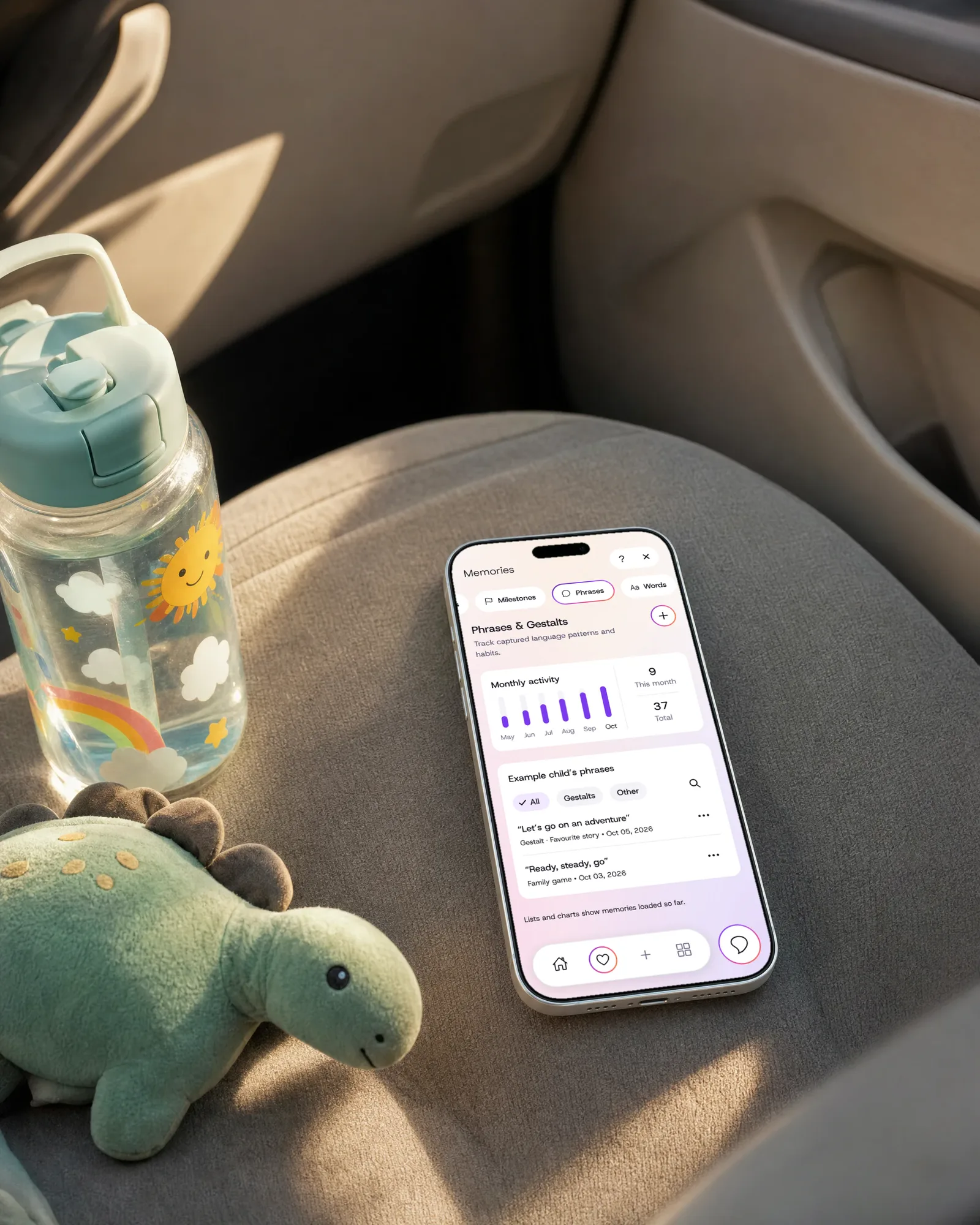A phone on a car seat showing saved phrases